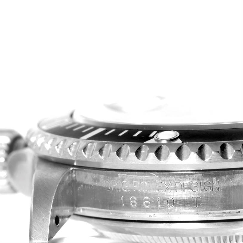 The image shows a close-up side view of a Rolex Submariner 16610 Men
s Stainless Steel Black Dial 16610 Men
s Stainless Steel Black Dial watch, focusing on the bezel, crown, case, and engraved model number.