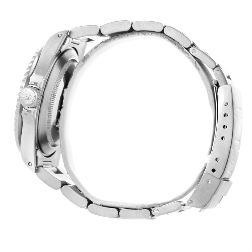 The image shows the side profile of a Rolex Submariner 16610 Men
s Stainless Steel Black Dial 16610 Men
s Stainless Steel Black Dial, highlighting its case, crown, and bracelet.