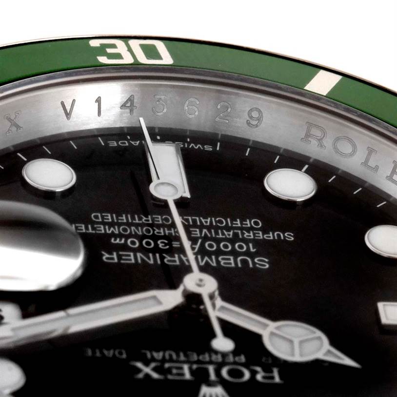 This close-up shows the dial, hands, and part of the green bezel of the Rolex Submariner 16610LV Men
s Stainless Steel Black Dial 16610LV Men
s Stainless Steel Black Dial watch.