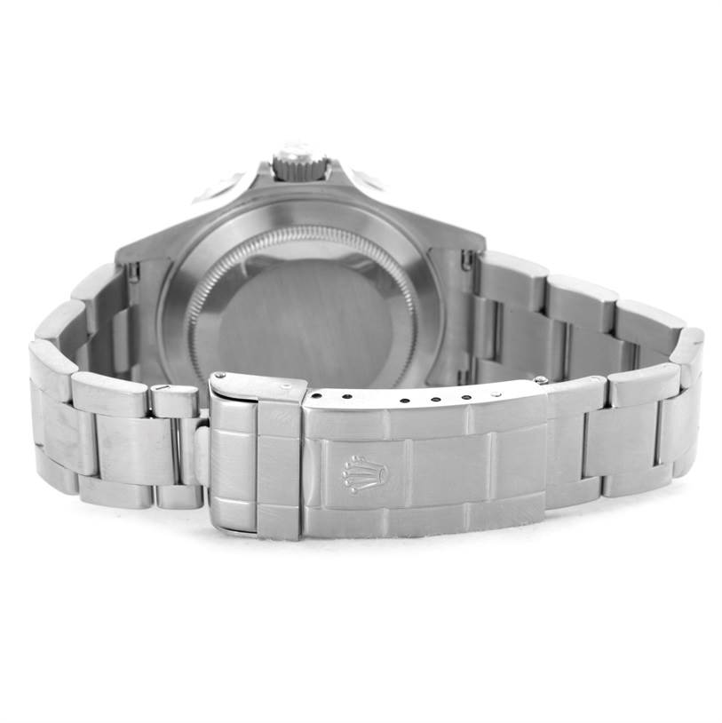 The image shows the back view of a Rolex Submariner 16610LV Men
s Stainless Steel Black Dial 16610LV Men
s Stainless Steel Black Dial watch, focusing on the case back and bracelet clasp.