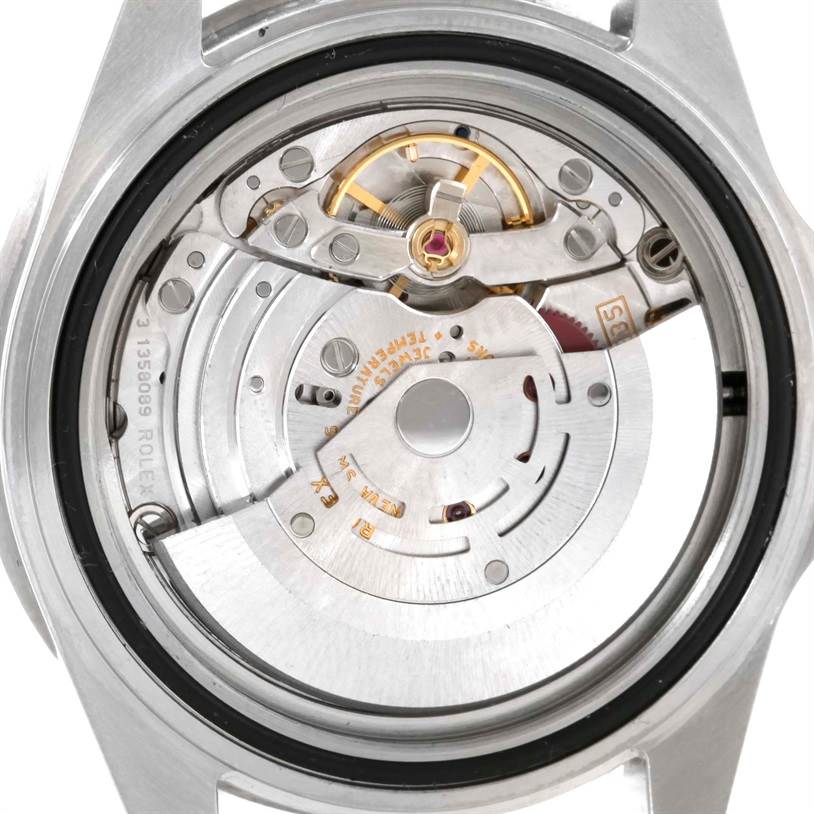 The image shows the intricate internal movement of a Rolex Submariner 16610LV Men
s Stainless Steel Black Dial 16610LV Men
s Stainless Steel Black Dial watch viewed from the back.