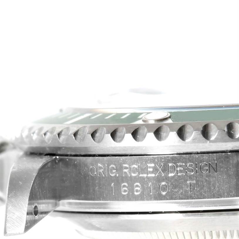 The image shows a side view of the Rolex Submariner 16610LV Men
s Stainless Steel Black Dial 16610LV Men
s Stainless Steel Black Dial, highlighting the bezel and case with the model number engraved.