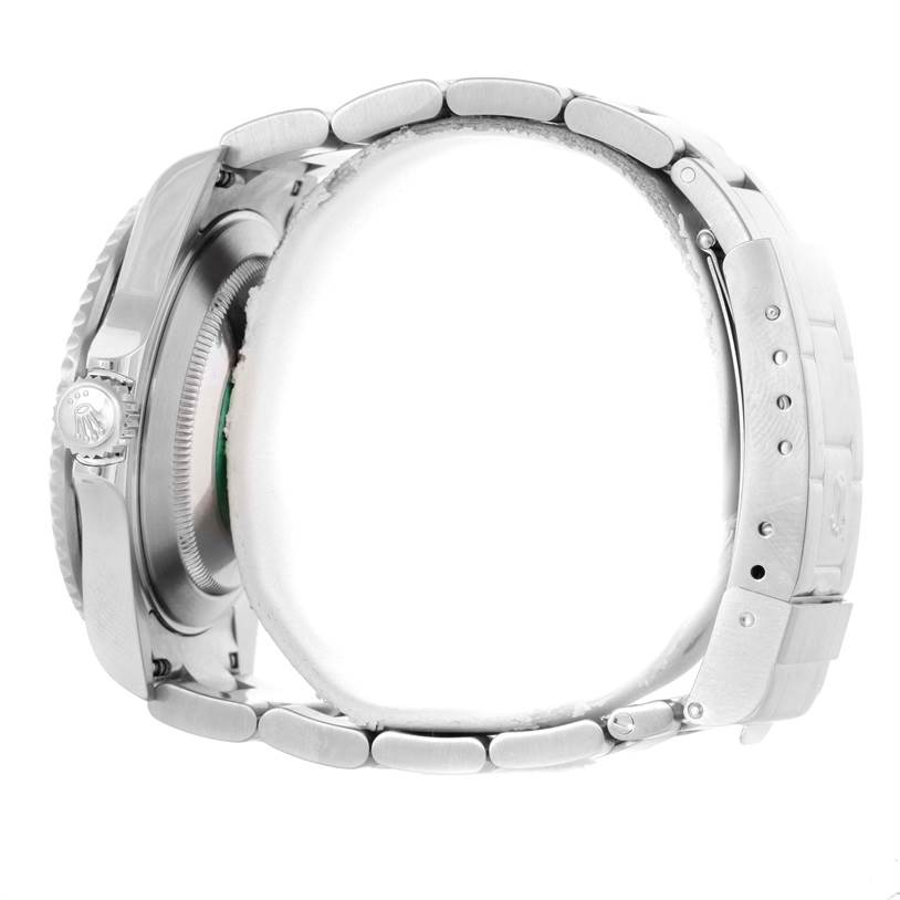 The image shows a side view of a Rolex Submariner 16610LV Men
s Stainless Steel Black Dial 16610LV Men
s Stainless Steel Black Dial, focusing on the crown, bezel, case, and bracelet.