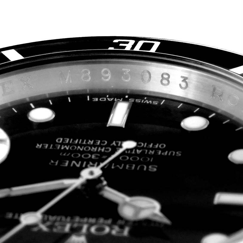 This close-up image shows the dial, bezel, and part of the case of a Rolex Submariner 16610 Men
s Stainless Steel Black Dial 16610 Men
s Stainless Steel Black Dial.