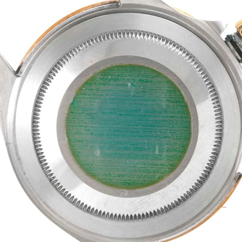 The image shows the case back of a Rolex Submariner 16613 Men's Steel and Gold (two tone) Blue Dial 16613 Men's Steel and Gold (two tone) Blue Dial watch.