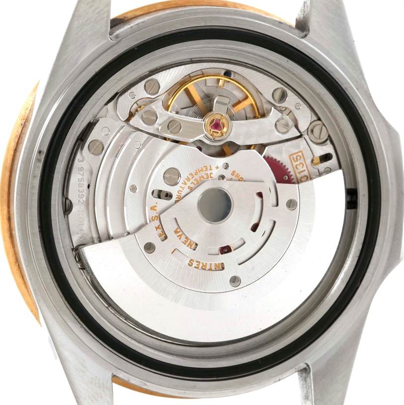 This image shows the internal movement mechanism of a Rolex Submariner 16613 Men's Steel and Gold (two tone) Blue Dial 16613 Men's Steel and Gold (two tone) Blue Dial watch from a back angle.