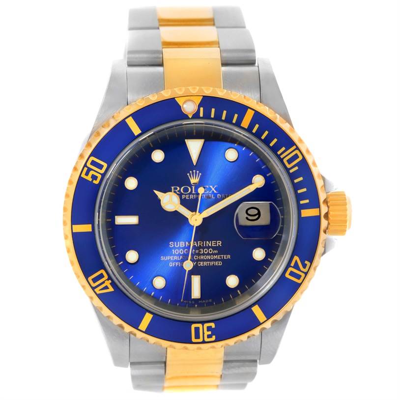 The image shows a Rolex Submariner 16613 Men's Steel and Gold (two tone) Blue Dial 16613 Men's Steel and Gold (two tone) Blue Dial watch from a front angle, highlighting its blue dial, two-tone bracelet, and date window.