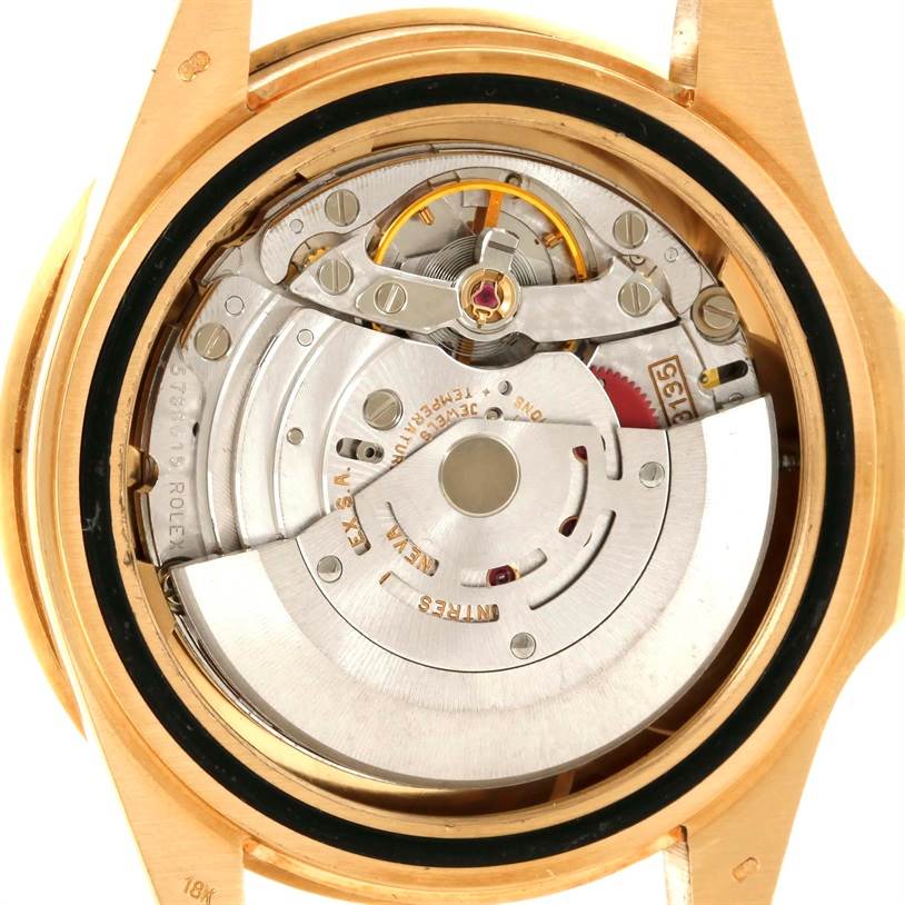 This is a close-up of the Rolex Submariner 16618 Men's Yellow Gold Blue Dial 16618 Men's Yellow Gold Blue Dial's movement mechanism, showcasing the intricate internal parts.