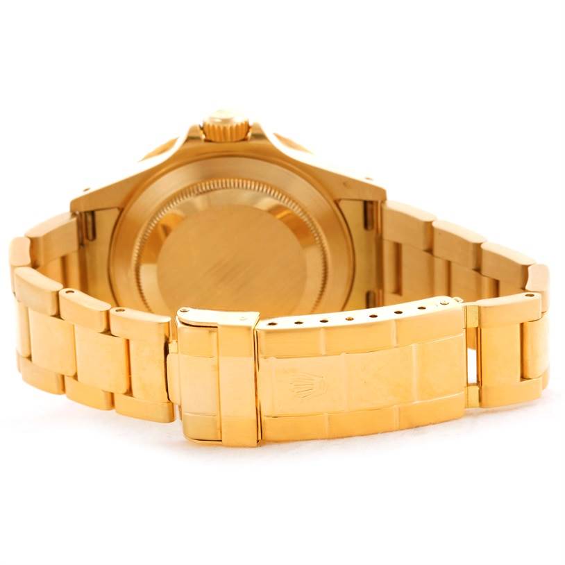 This image shows the backside and clasp of the Rolex Submariner 16618 Men's Yellow Gold Blue Dial 16618 Men's Yellow Gold Blue Dial watch in a gold finish.