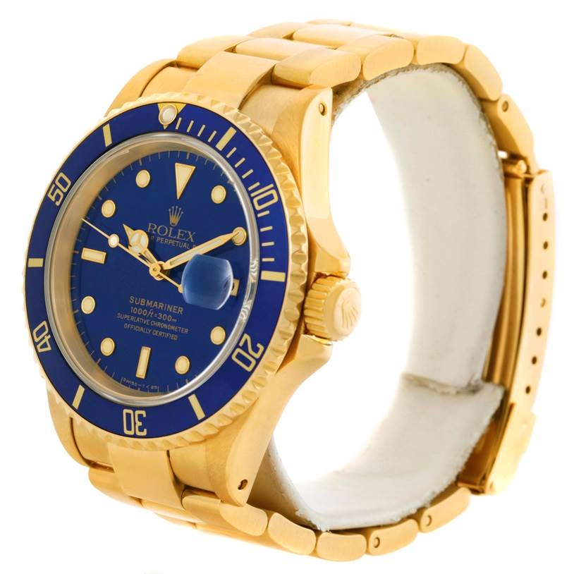 This image features a Rolex Submariner 16618 Men's Yellow Gold Blue Dial 16618 Men's Yellow Gold Blue Dial watch at a slight angle, showcasing its blue dial, bezel, and gold bracelet.