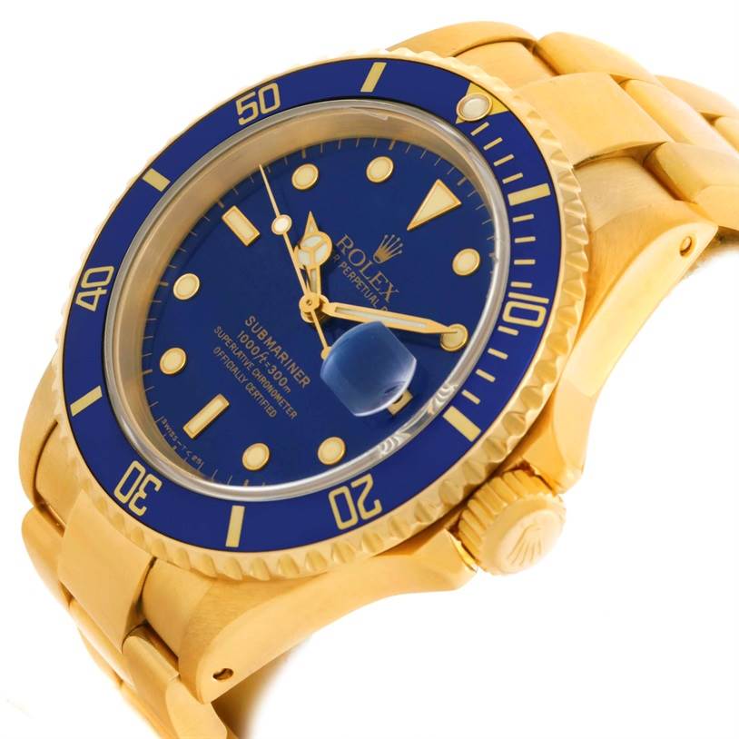 The Rolex Submariner 16618 Men's Yellow Gold Blue Dial 16618 Men's Yellow Gold Blue Dial watch is shown from an angled view, highlighting the bezel, dial, and crown.
