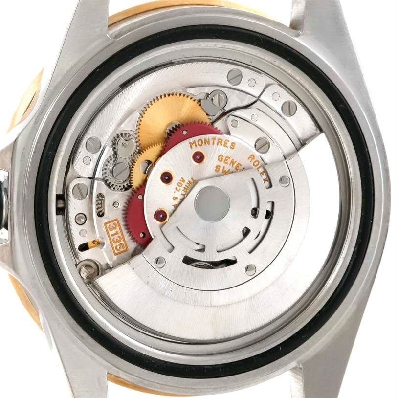 This image shows the back view of a Rolex Submariner 16613 Men
s Steel and Gold (two tone) Blue Dial 16613 Men
s Steel and Gold (two tone) Blue Dial watch, revealing its intricate internal mechanical movement.