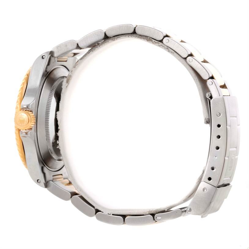 The image shows the right side view of a Rolex Submariner 16613 Men
s Steel and Gold (two tone) Blue Dial 16613 Men
s Steel and Gold (two tone) Blue Dial watch, focusing on the bracelet and side of the case.