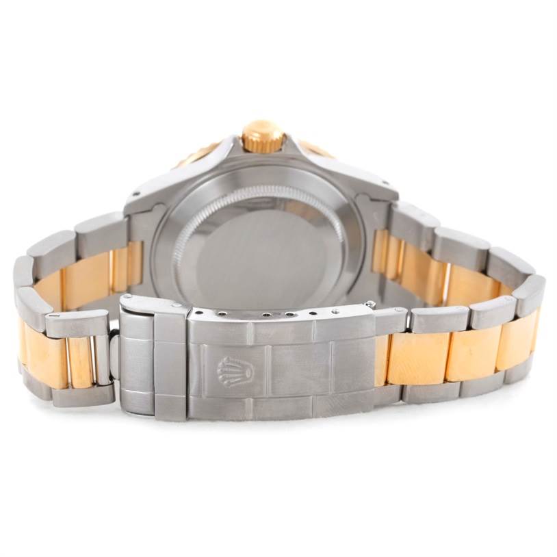 The image shows the back case, crown, and bracelet clasp of a Rolex Submariner 16613 Men
s Steel and Gold (two tone) Blue Dial 16613 Men
s Steel and Gold (two tone) Blue Dial watch from the rear angle.