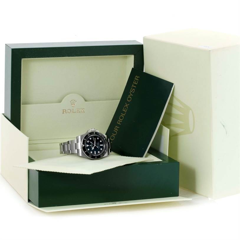 The Rolex Submariner 116610 Men
s Stainless Steel Black Dial 116610 Men
s Stainless Steel Black Dial watch is shown in its original box with accompanying documentation and packaging material from a front angle.
