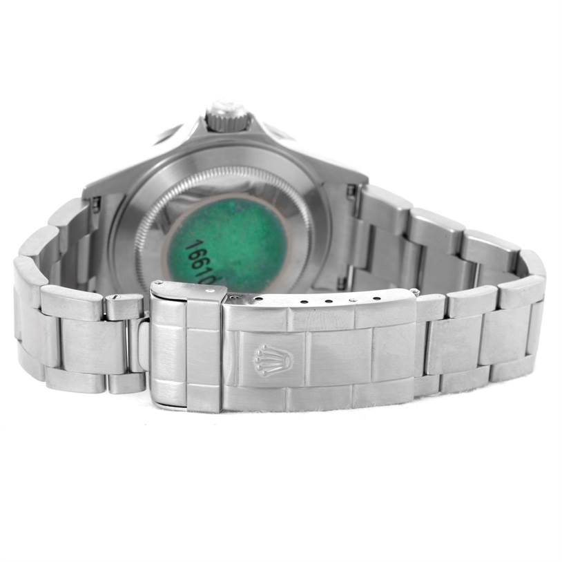 The image shows the rear view of a Rolex Submariner 16610 Men
s Stainless Steel Black Dial 16610 Men
s Stainless Steel Black Dial watch, focusing on the case back, bracelet, and clasp.