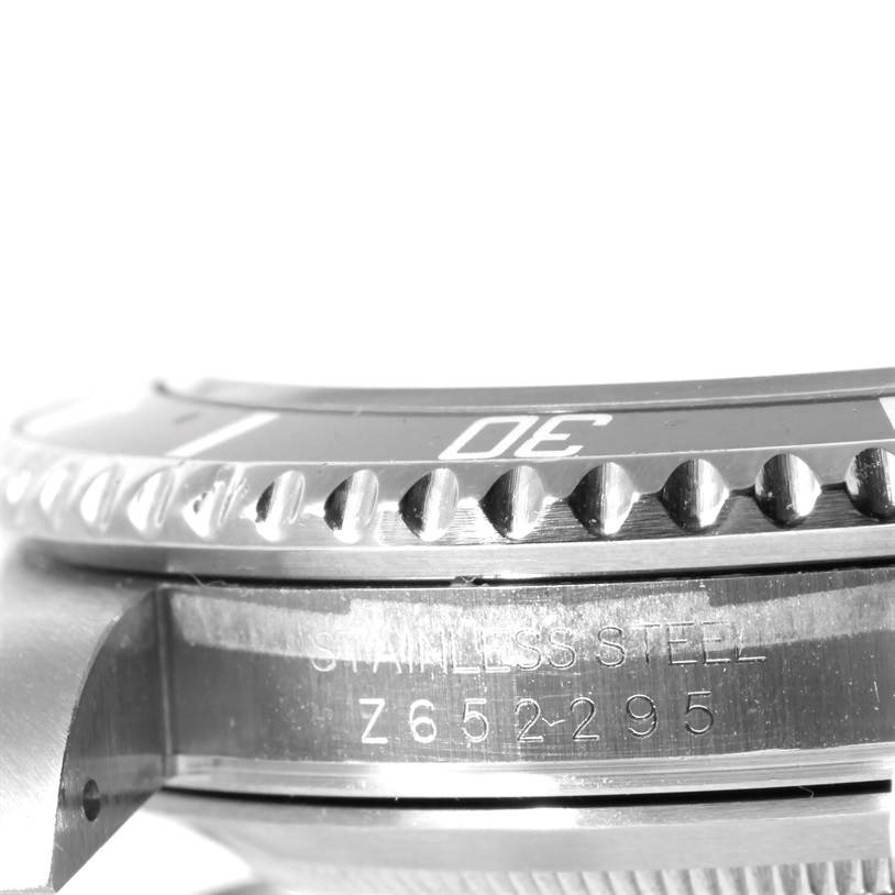 This close-up image shows the bezel and case side of a Rolex Submariner 16610 Men
s Stainless Steel Black Dial 16610 Men
s Stainless Steel Black Dial watch, highlighting the stainless steel engraving.