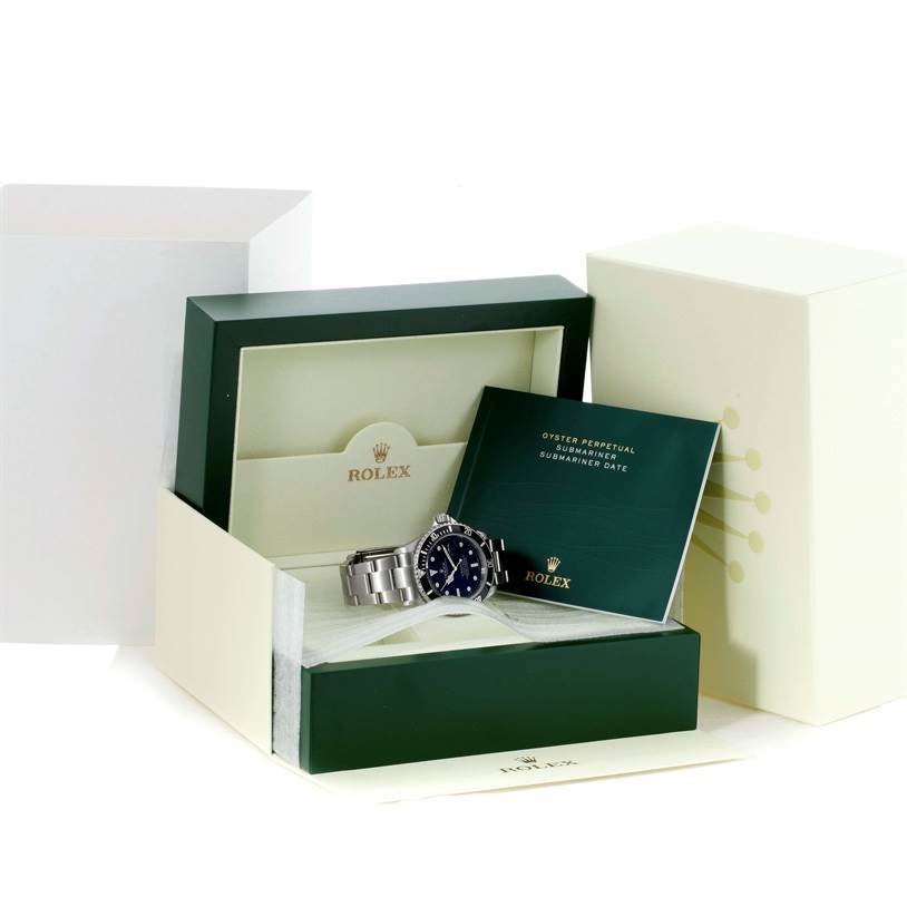 This image shows a Rolex Submariner 16610 Men
s Stainless Steel Black Dial 16610 Men
s Stainless Steel Black Dial watch, its open display box, and the accompanying manual from a front angle.