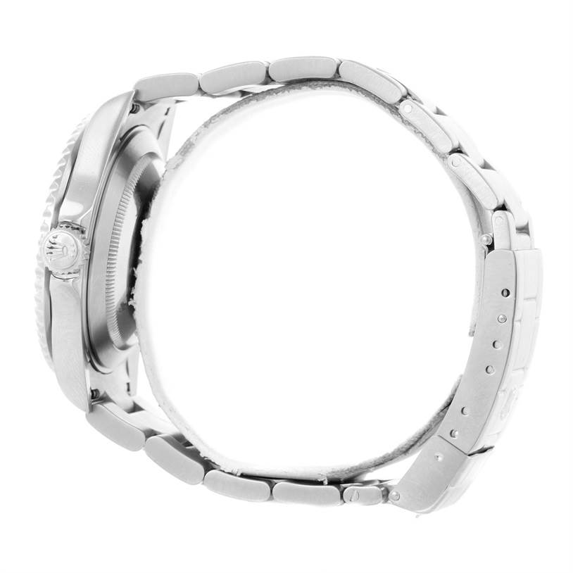 The image shows a side view of a Rolex Submariner 16610 Men
s Stainless Steel Black Dial 16610 Men
s Stainless Steel Black Dial watch, focusing on its case, crown, and bracelet.