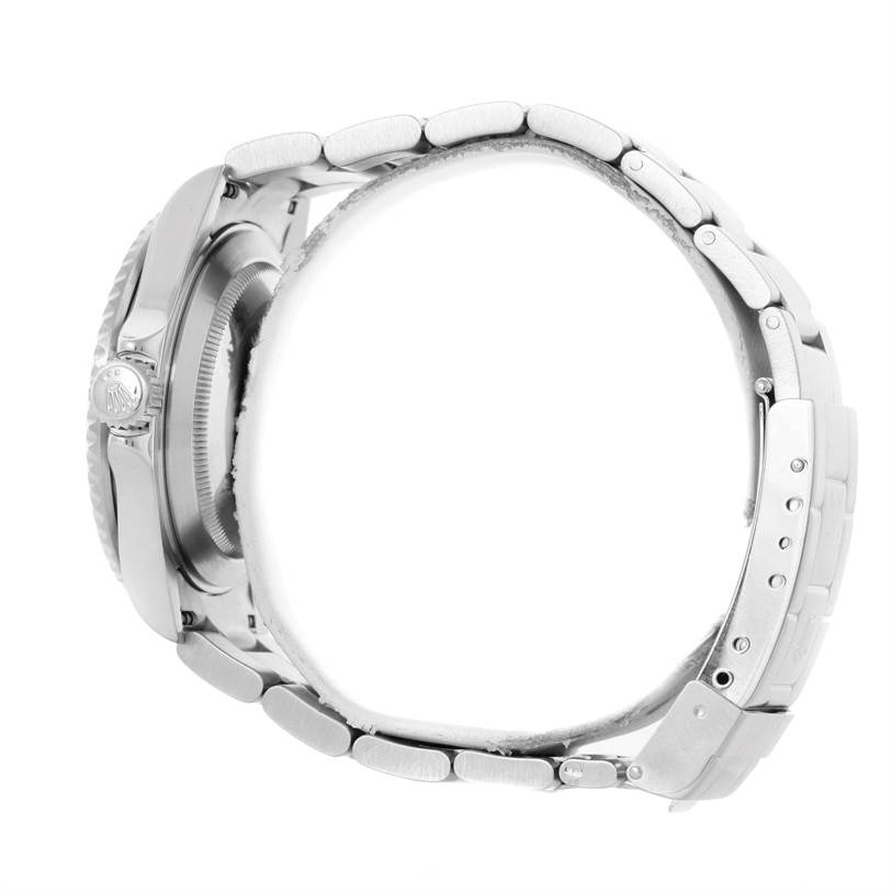 The image shows a side profile of a Rolex Submariner 16610 Men
s Stainless Steel Black Dial 16610 Men
s Stainless Steel Black Dial, highlighting the bracelet, side case, and crown.