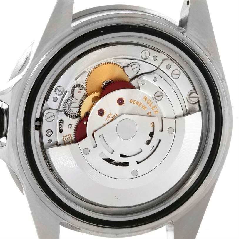 This image shows the back view of a Rolex Submariner 16610 Men
s Stainless Steel Black Dial 16610 Men
s Stainless Steel Black Dial watch, revealing its internal movement and gears.