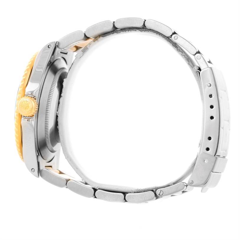 The image shows a side view of a Rolex Submariner 16613 Men's Steel and Gold (two tone) Black Dial 16613 Men's Steel and Gold (two tone) Black Dial watch, highlighting the crown, bezel, and bracelet.