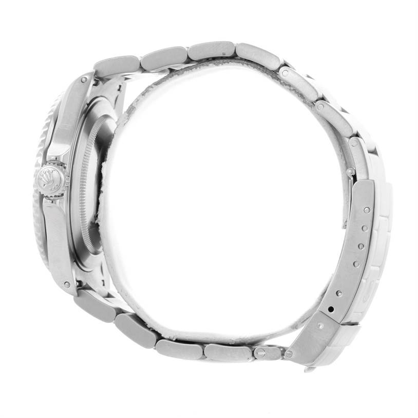 The image shows a side view of a Rolex Submariner 16610 Men
s Stainless Steel Black Dial 16610 Men
s Stainless Steel Black Dial watch, highlighting its metal band, clasp, and crown.