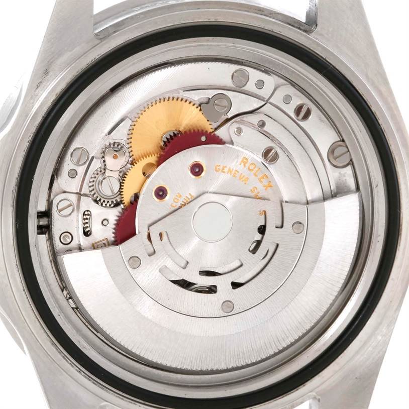 This is a close-up view of the internal mechanism of a Rolex Submariner 16610 Men
s Stainless Steel Black Dial 16610 Men
s Stainless Steel Black Dial watch, showing its gears and movement components.