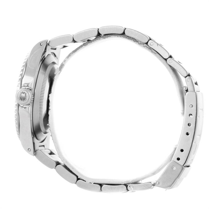 The image shows a Rolex Submariner 14060 Men
s Stainless Steel Black Dial 14060 Men
s Stainless Steel Black Dial watch from a side angle, highlighting the bracelet, case, and crown with the Rolex logo.