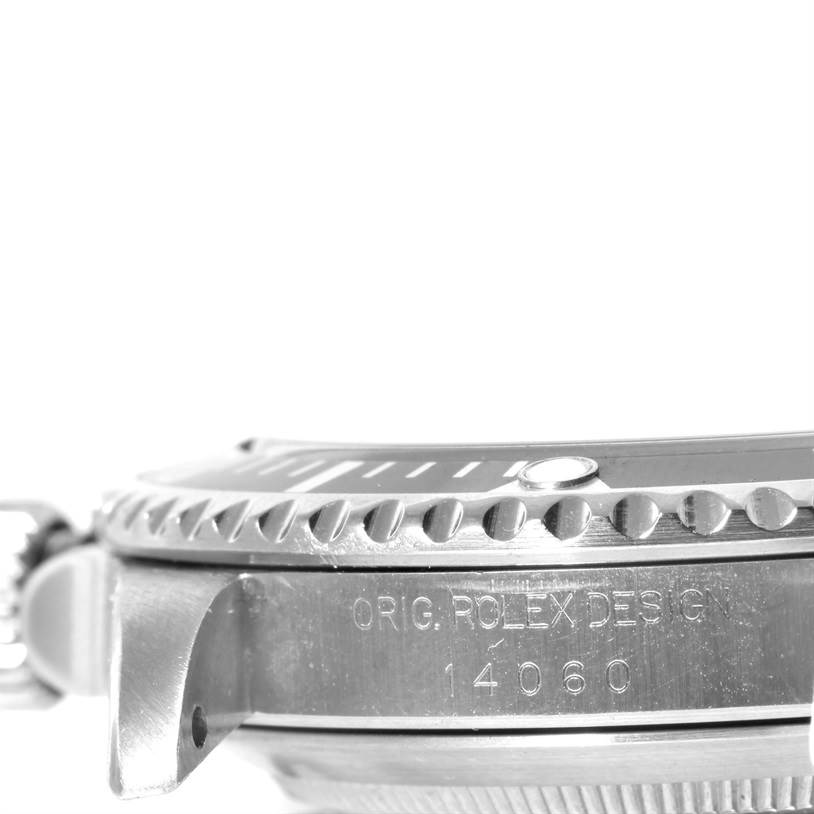 This image shows a side view of the bezel and case of a Rolex Submariner 14060 Men
s Stainless Steel Black Dial 14060 Men
s Stainless Steel Black Dial, model number 14060.