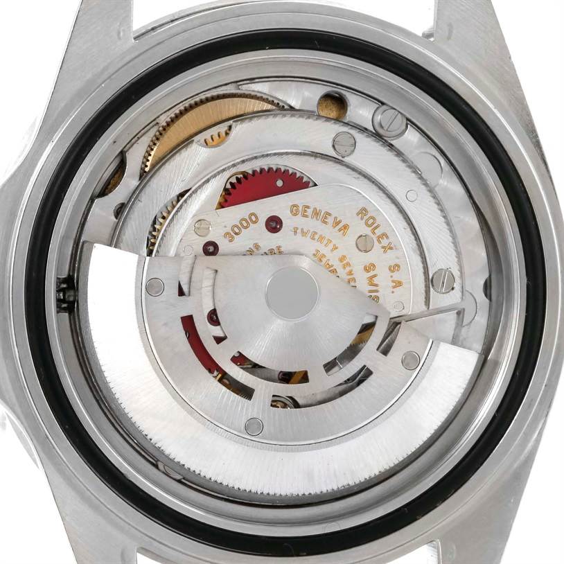 This image shows the movement and internal mechanism of a Rolex Submariner 14060 Men
s Stainless Steel Black Dial 14060 Men
s Stainless Steel Black Dial watch from the back.