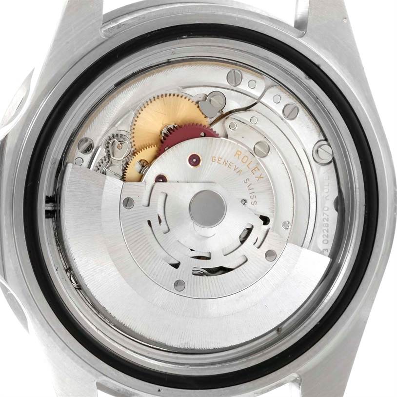 This image shows the back view of the Rolex Submariner 16610 Men
s Stainless Steel Black Dial 16610 Men
s Stainless Steel Black Dial watch, revealing its intricate mechanical movement and inner components.