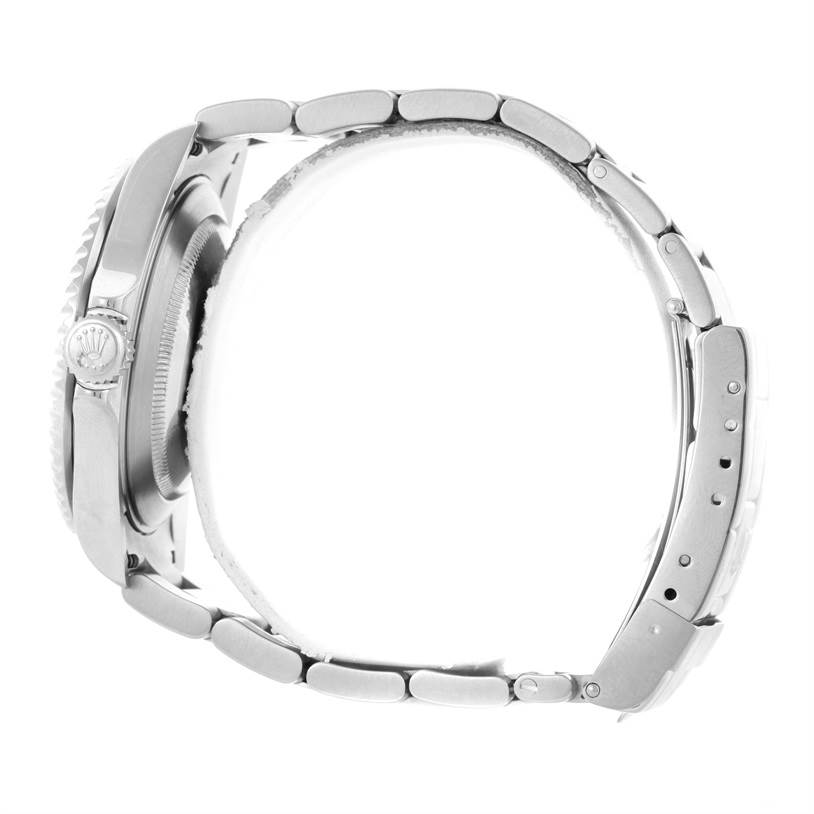 The image shows a side profile of a Rolex Submariner 16610 Men
s Stainless Steel Black Dial 16610 Men
s Stainless Steel Black Dial watch, highlighting the crown and stainless steel bracelet.