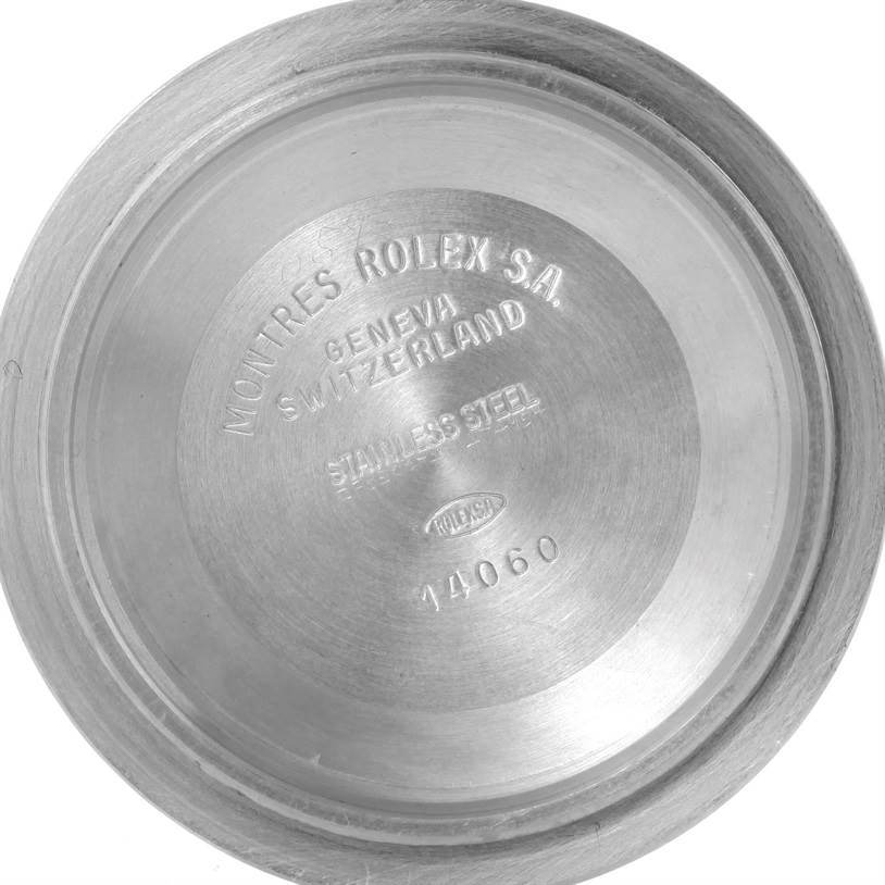 This is the inside view of the case back of a Rolex Submariner 14060 Men
s Black Dial 14060 Men
s Black Dial watch, showing engraving details and model number 14060.