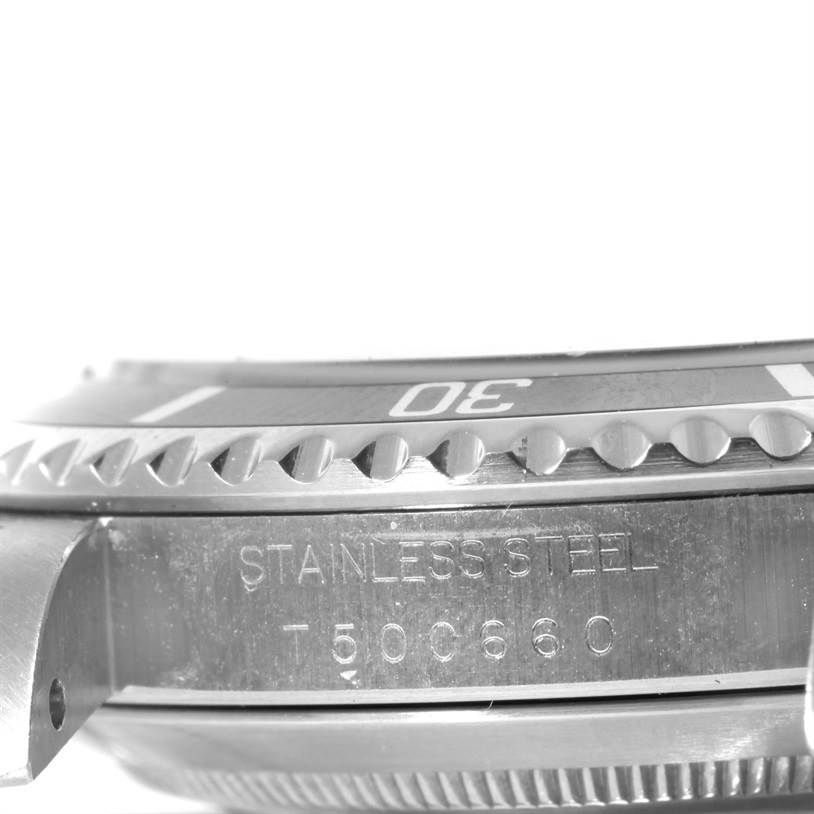 This image shows a close-up of the bezel and case side, part of the stainless steel Rolex Submariner 14060 Men
s Black Dial 14060 Men
s Black Dial.