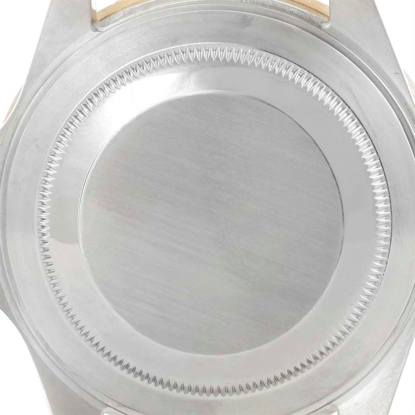 This image shows the case back of a Rolex Submariner 16613 Men
s Steel and Gold (two tone) Blue Dial 16613 Men
s Steel and Gold (two tone) Blue Dial watch from a close-up, rear angle.