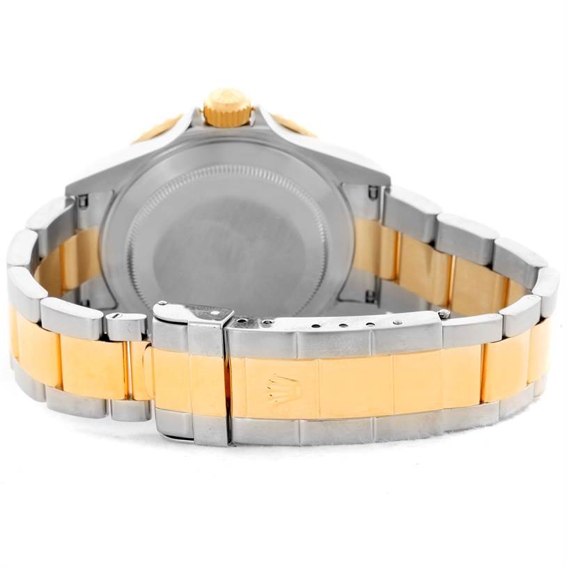 The image shows the back and bracelet of a Rolex Submariner 16613 Men's Steel and Gold (two tone) Blue Dial 16613 Men's Steel and Gold (two tone) Blue Dial watch, highlighting its two-tone design and clasp.