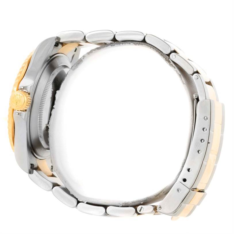 The image shows a side angle of the Rolex Submariner 16613 Men
s Steel and Gold (two tone) Blue Dial 16613 Men
s Steel and Gold (two tone) Blue Dial watch, highlighting the bezel, crown, and bracelet.