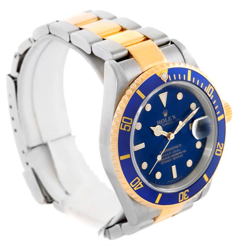 The Rolex Submariner 16613 Men
s Steel and Gold (two tone) Blue Dial 16613 Men
s Steel and Gold (two tone) Blue Dial watch is shown at a slight angle, displaying the face, bezel, and part of the bracelet.