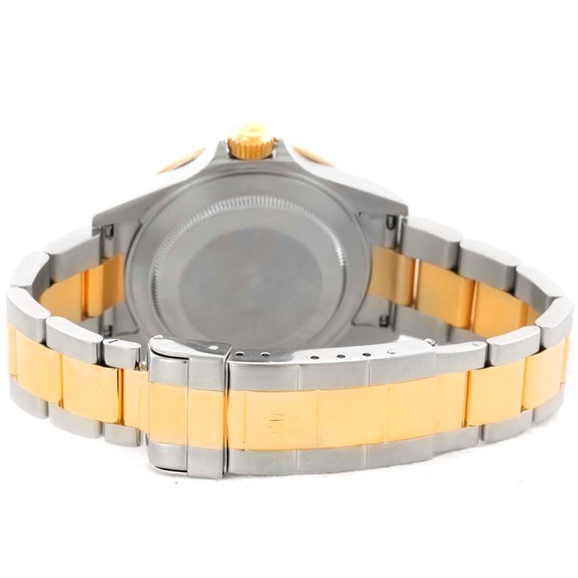 The image shows the back case and bracelet of a Rolex Submariner 16613 Men
s Steel and Gold (two tone) Blue Dial 16613 Men
s Steel and Gold (two tone) Blue Dial watch from a rear angle.