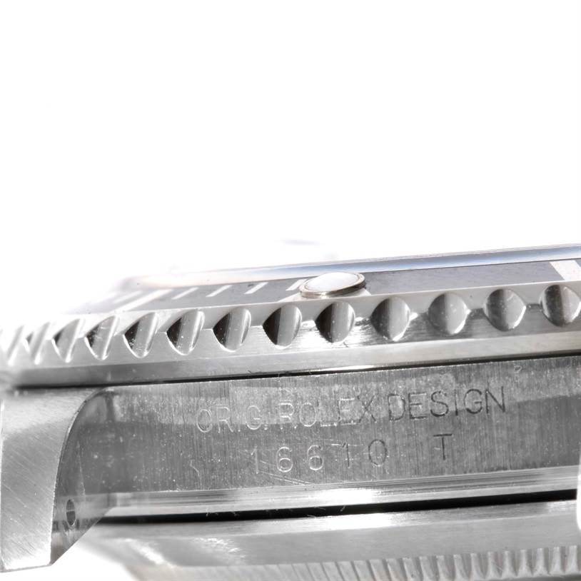 The image shows a close-up side view of the bezel and case of a Rolex Submariner 16610 Men
s Stainless Steel Black Dial 16610 Men
s Stainless Steel Black Dial watch, including engraved model details.