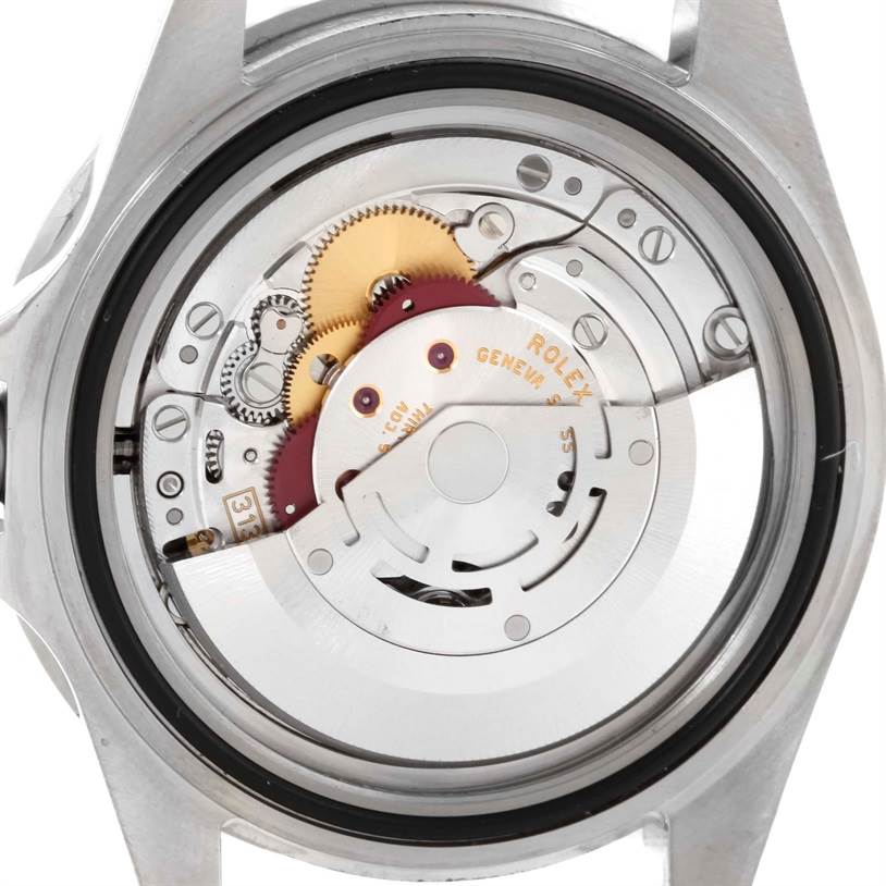 This is a close-up view of the internal mechanism of a Rolex Submariner 16610 Men
s Stainless Steel Black Dial 16610 Men
s Stainless Steel Black Dial watch, showing gears and the rotor.