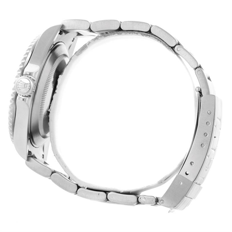 The image shows a side profile of a Rolex Submariner 16610 Men
s Stainless Steel Black Dial 16610 Men
s Stainless Steel Black Dial, featuring the bracelet, crown, and part of the case.