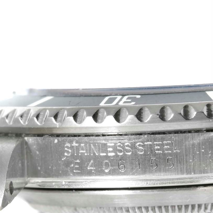 This image shows a close-up of the bezel and case of a Rolex Submariner 16610 Men
s Stainless Steel Black Dial 16610 Men
s Stainless Steel Black Dial watch, highlighting the stainless steel engraving.