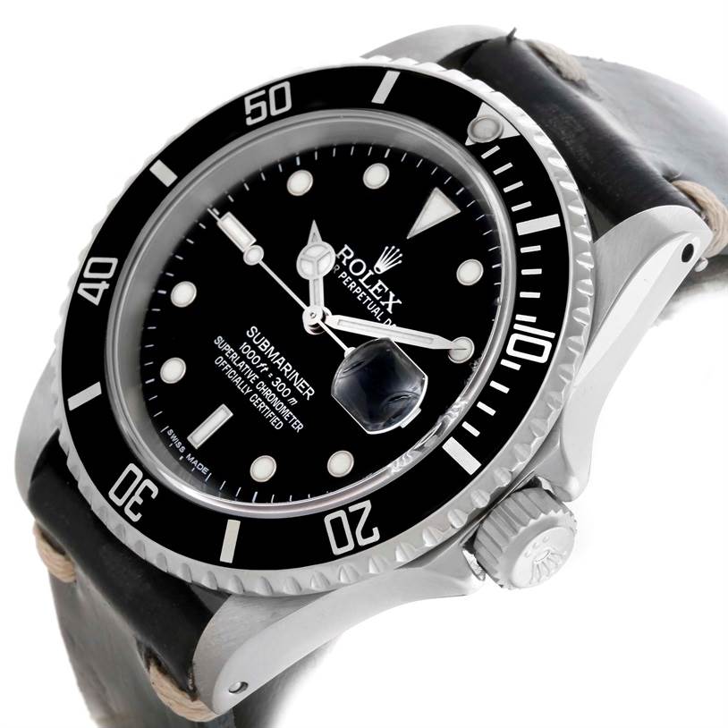 This is an angled close-up view of a Rolex Submariner 16610 Men
s Stainless Steel Black Dial 16610 Men
s Stainless Steel Black Dial watch, showing the dial, bezel, crown, and part of the leather strap.