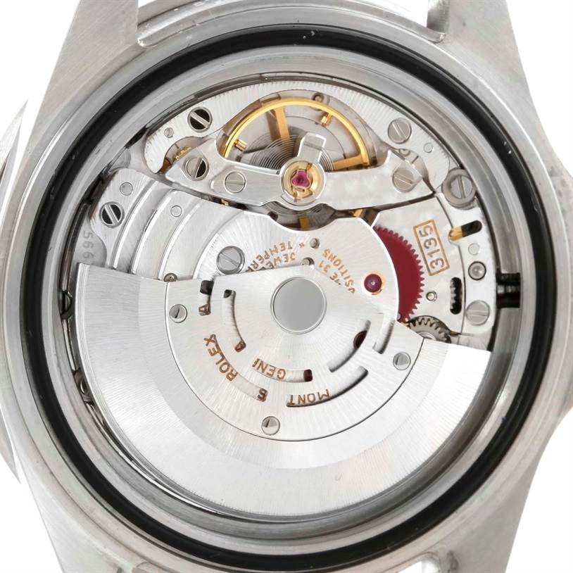 The image shows the movement mechanism of a Rolex Submariner 16610 Men
s Stainless Steel Black Dial 16610 Men
s Stainless Steel Black Dial watch viewed from the back.