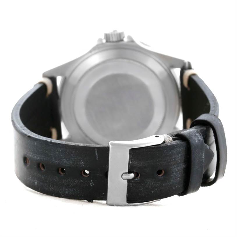 The image shows the back case and leather strap of a Rolex Submariner 16610 Men
s Stainless Steel Black Dial 16610 Men
s Stainless Steel Black Dial watch from a rear angle.