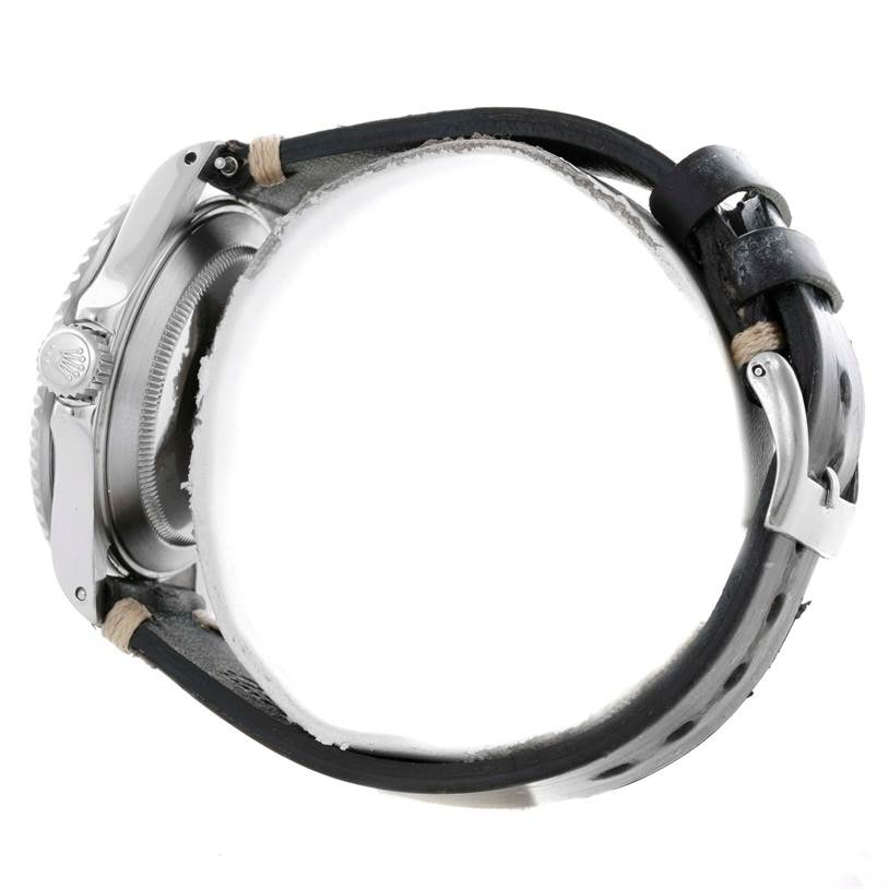 This image shows a side view of the Rolex Submariner 16610 Men
s Stainless Steel Black Dial 16610 Men
s Stainless Steel Black Dial watch featuring its case, crown, and leather strap with a buckle.