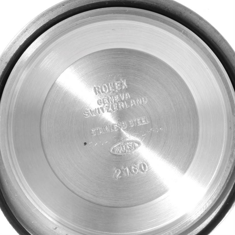 This is an image of the inside case back of a Rolex Submariner 14060 Men
s Stainless Steel Black Dial 14060 Men
s Stainless Steel Black Dial watch, showing the engraved model details.