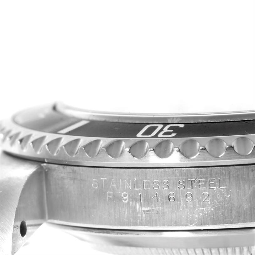 This close-up angle shows the bezel, case, and model number engraving of a Rolex Submariner 14060 Men
s Stainless Steel Black Dial 14060 Men
s Stainless Steel Black Dial watch.